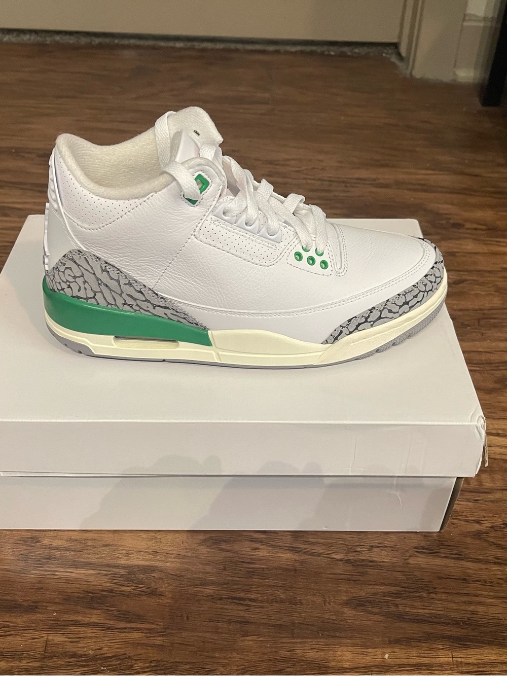 Air Jordan 3 Retro White Leather Sneaker with Green Accents and Elephant Print